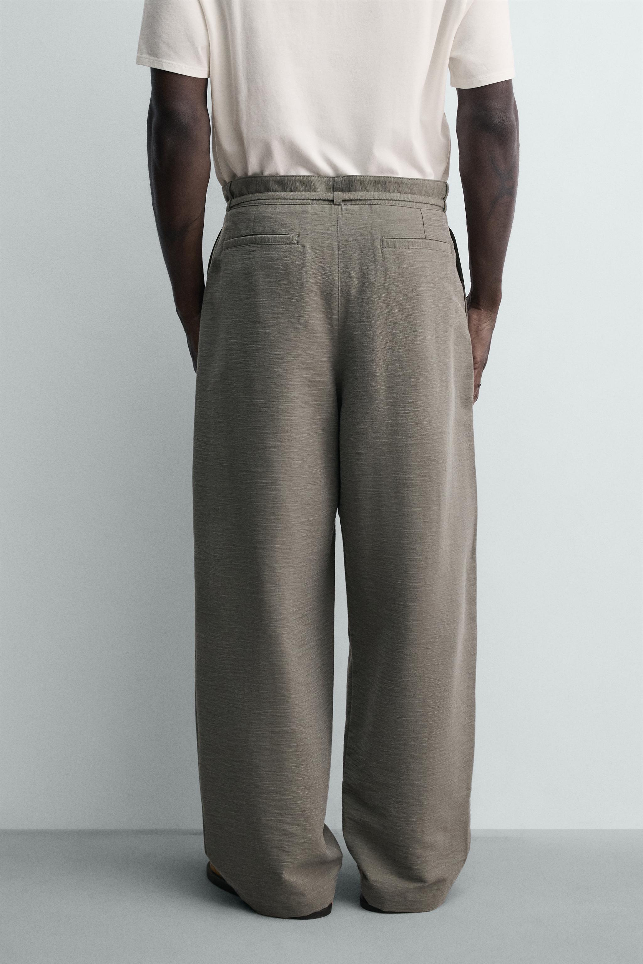 BALLOON FIT PLEATED BELTED PANTS
